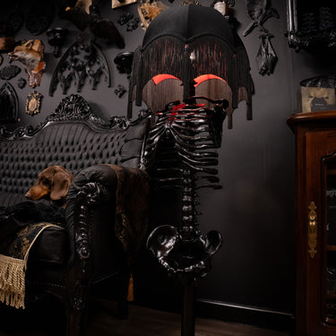 skeleton floor lamp in gothic living room with victorian gothic style decor black room
